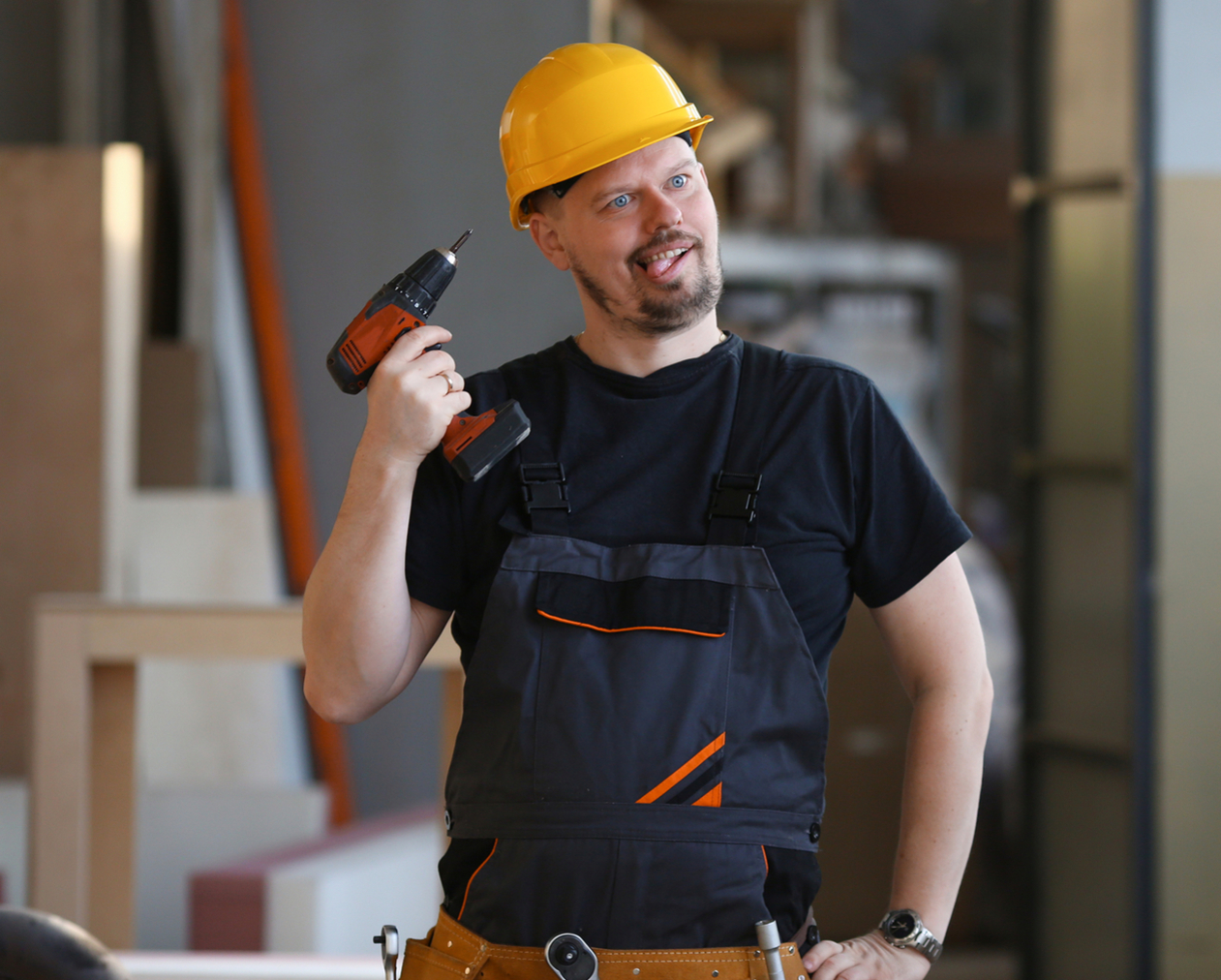 Construction man with hard hat and drill