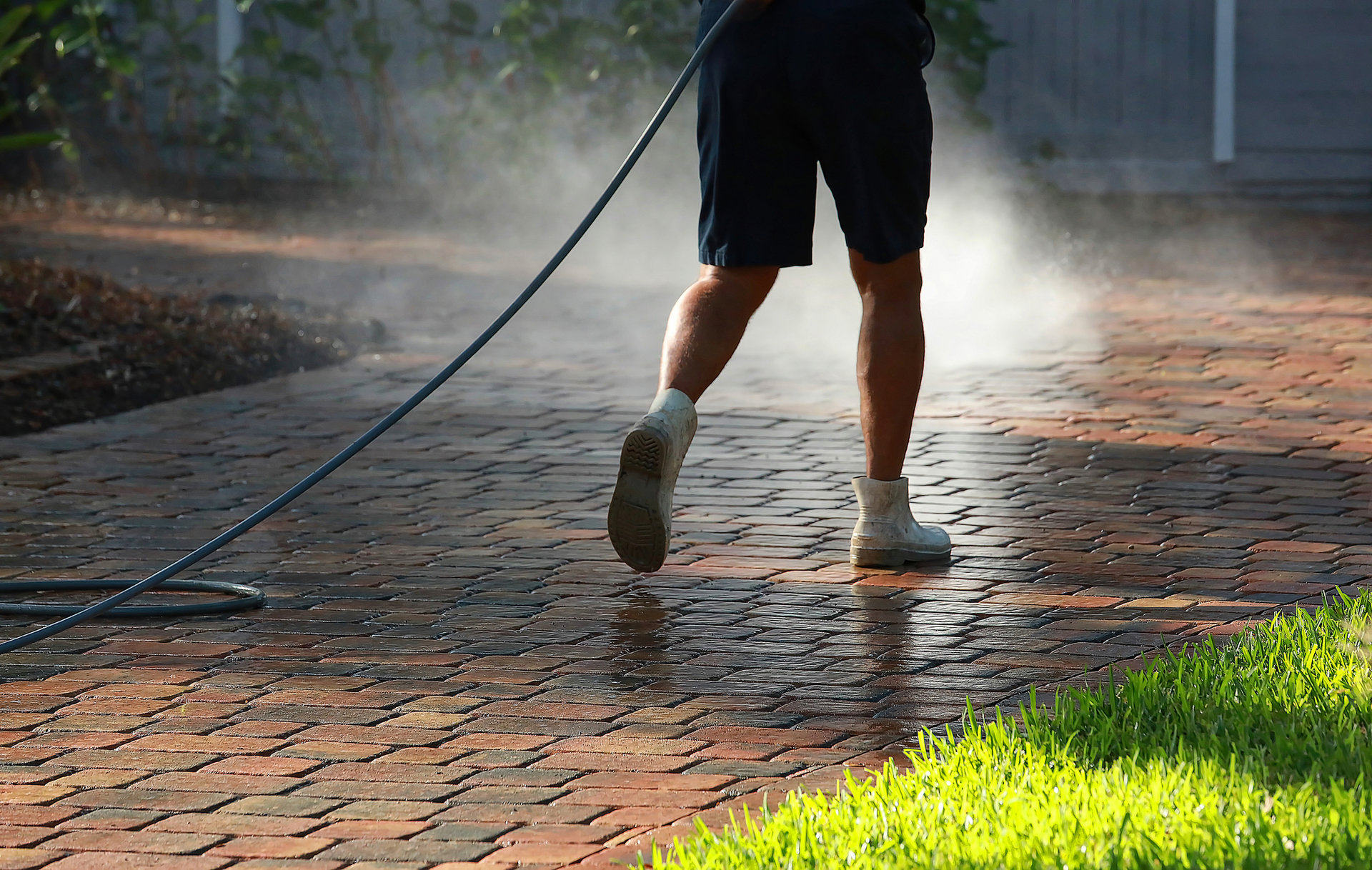 Man cleaning driveway